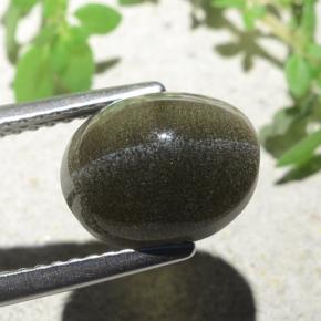 Cat's Eye Scapolite طبيعي بلون بني مخضر، وزن ‎4.00‎ قيراط، شكل بيضاوى، مقاس ‎10x8‎ مم