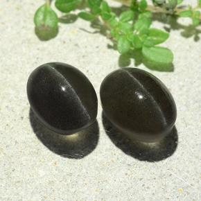 Cat's Eye Scapolite طبيعي بلون رمادي داكن، وزن ‎7.38‎ قيراط، شكل بيضاوى، مقاس ‎9.9x7.5‎ مم