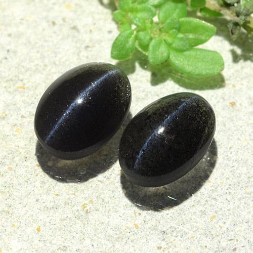 Cat's Eye Scapolite طبيعي بلون أسود، وزن ‎2.59‎ قيراط، شكل بيضاوى، مقاس ‎8.1x5.7‎ مم