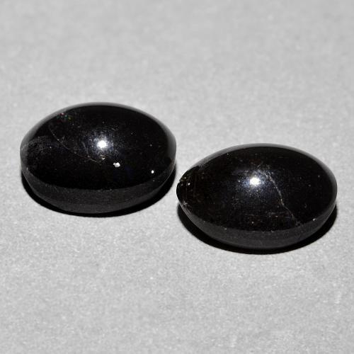 Cat's Eye Scapolite طبيعي بلون أسود، وزن ‎4.74‎ قيراط، شكل بيضاوى، مقاس ‎8.9x6.9‎ مم