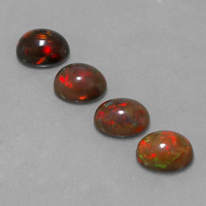 أوبال شوكولاتي طبيعي بلون متعدد الألوان، وزن ‎‎ قيراط، شكل بيضاوى، مقاس ‎7.9x6.1‎ مم