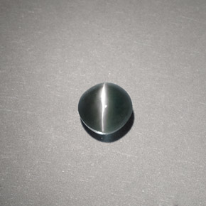 Chrysoberyl Cat's Eye طبيعي بلون أخضر، وزن ‎0.65‎ قيراط، شكل دائري، مقاس ‎4.59‎ مم
