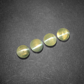 Chrysoberyl Cat's Eye طبيعي بلون أخضر مصفر، وزن ‎‎ قيراط، شكل شفاف، مقاس ‎4.04‎ مم