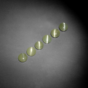 Chrysoberyl Cat's Eye طبيعي بلون أخضر مصفر، وزن ‎‎ قيراط، شكل شفاف، مقاس ‎4.07‎ مم