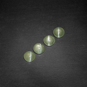 Chrysoberyl Cat's Eye طبيعي بلون أخضر مصفر، وزن ‎‎ قيراط، شكل شفاف، مقاس ‎4.04‎ مم