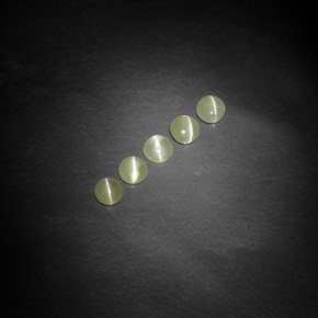 أحجار عين القط كريزوبيريل أخضر مصفر طبيعية، شفاف، شفاف / نصف شفاف، وزنها  قيراط