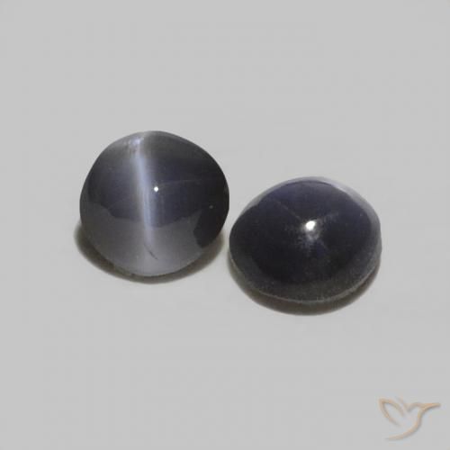 أحجار عين القط كريزوبيريل رمادي غامق طبيعية، بيضوي، غير شفاف، وزنها 0.38 قيراط