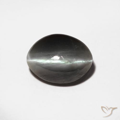 Chrysoberyl Cat's Eye طبيعي بلون رمادى متوسط، وزن ‎0.88‎ قيراط، شكل بيضاوى، مقاس ‎6.7x5‎ مم