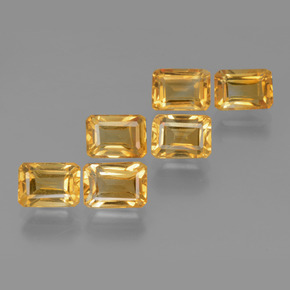 سيترين طبيعي بلون Orange-Gold ، وزن ‎6.92‎ قيراط، شكل قص الزمرد، مقاس ‎7.1x5.1‎ مم