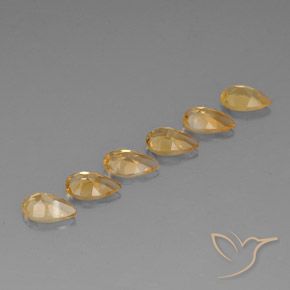 أحجار سيترين Medium-Light Orange-Gold  طبيعية، شكل الكمثرى، VVS-VS، وزنها 4.06 قيراط