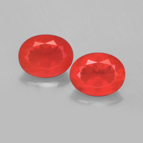 أحجار النار أوبال برتقالى محمر طبيعية، قصة بيضاوى، شفاف، وزنها  قيراط