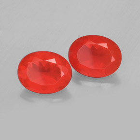 أحجار النار أوبال برتقالى محمر طبيعية، قصة بيضاوى، شفاف، وزنها  قيراط