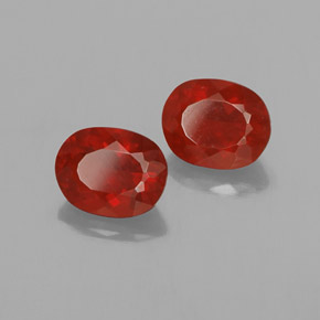 أحجار النار أوبال برتقالى محمر طبيعية، قصة بيضاوى، شفاف، وزنها  قيراط