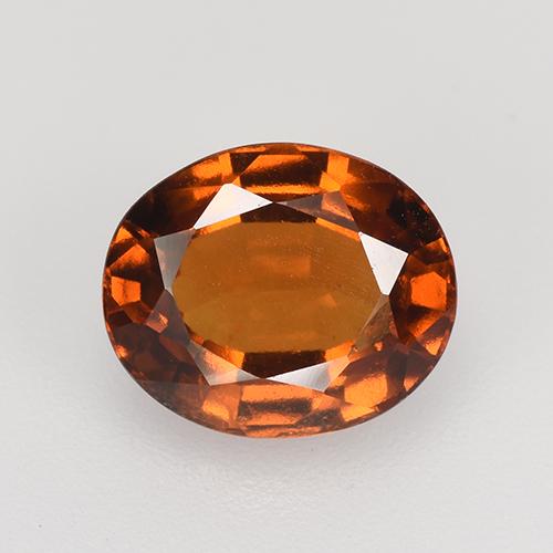 جارنيت هيسونيت طبيعي بلون برتقالي عميق، وزن ‎2.47‎ قيراط، شكل بيضاوى، مقاس ‎8.8x7.3‎ مم