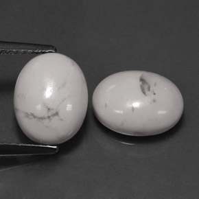 أحجار حجر الهاوليت أبيض رمادى طبيعية، قصة بيضاوى، غير شفاف، وزنها  قيراط