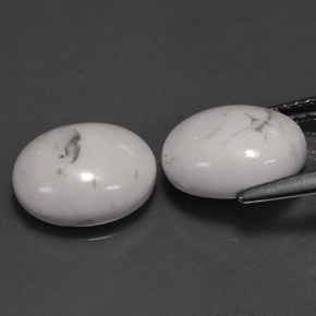 أحجار حجر الهاوليت أبيض رمادى طبيعية، قصة بيضاوى، غير شفاف، وزنها  قيراط