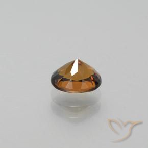 جارنيت مالي طبيعي بلون Light Earth Orange، وزن ‎0.92‎ قيراط، شكل بيضاوى، مقاس ‎6.3x5.1‎ مم