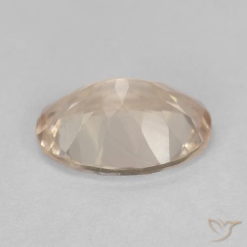 مورغانيت طبيعي بلون Light Neutral Orange، وزن ‎0.93‎ قيراط، شكل بيضاوى، مقاس ‎7.9x5.9‎ مم