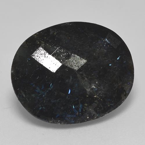 نوميت طبيعي بلون أسود مع بريق أزرق، وزن ‎14.99‎ قيراط، شكل بيضاوى، مقاس ‎18x14.7‎ مم