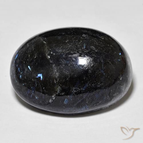 28.34ct طبيعي أسود مع بريق أزرق نوميت, بيضوي, غير شفاف