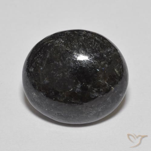 6.70ct طبيعي أسود مع بريق أزرق نوميت, بيضوي, غير شفاف