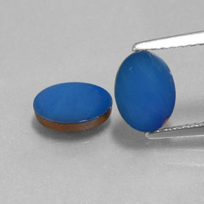 أوبال مزدوج طبيعي بلون Cobalt Blue، وزن ‎1.44‎ قيراط، شكل بيضاوى، مقاس ‎8x6‎ مم