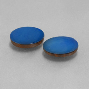 أوبال مزدوج طبيعي بلون Cobalt Blue، وزن ‎1.44‎ قيراط، شكل بيضاوى، مقاس ‎8x6‎ مم