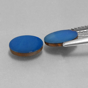 أوبال مزدوج طبيعي بلون Cobalt Blue، وزن ‎1.44‎ قيراط، شكل بيضاوى، مقاس ‎8x6‎ مم