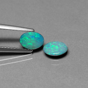 أحجار أوبال دوبليت متعدد الألوان طبيعية، قصة بيضاوى، غير شفاف، وزنها  قيراط