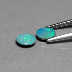 أحجار أوبال دوبليت متعدد الألوان طبيعية، قصة بيضاوى، غير شفاف، وزنها  قيراط