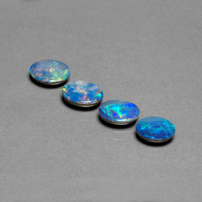 أوبال مزدوج طبيعي بلون متعدد الألوان، وزن ‎‎ قيراط، شكل بيضاوى، مقاس ‎7.1x5.2‎ مم