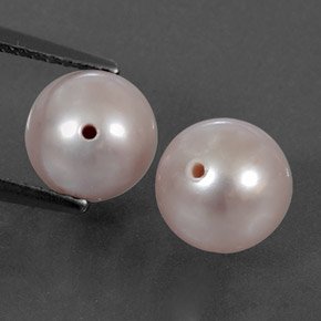 أحجار لؤلؤة وردى برتقالى طبيعية، جسم كروى / الكرة، غير شفاف، وزنها 5.61 قيراط