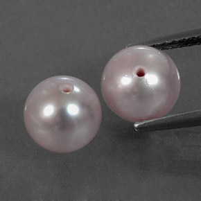 أحجار لؤلؤة وردى فضى طبيعية، جسم كروى / الكرة، غير شفاف، وزنها  قيراط