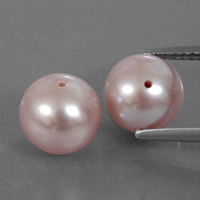 أحجار لؤلؤ وردى برتقالى طبيعية، جسم كروى / الكرة، غير شفاف، وزنها 6.50 قيراط