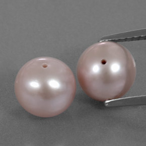 أحجار لؤلؤة وردى برتقالى طبيعية، جسم كروى / الكرة، غير شفاف، وزنها 6.38 قيراط