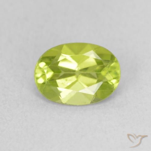 0.87ct طبيعي أخضر مصفر حيوى زبرجد, بيضوي, قليلا جدا