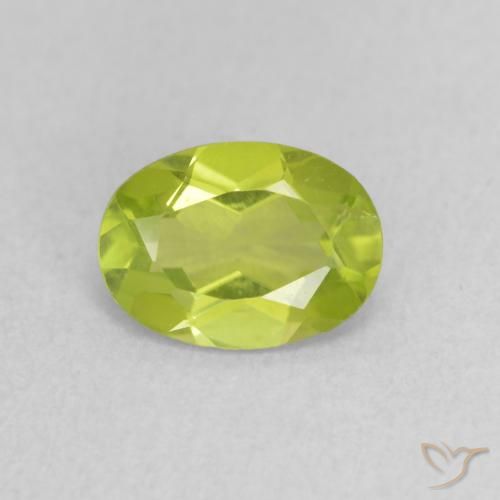 0.81ct طبيعي أخضر مصفر حيوى زبرجد, بيضوي, قليلا جدا