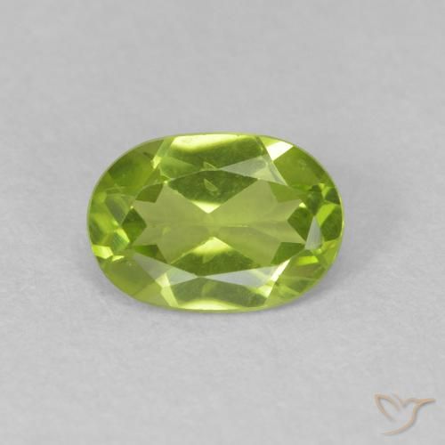 0.82ct طبيعي اخضر زاهى زبرجد, بيضوي, قليلا جدا, Photo A