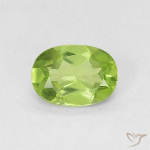 0.90ct طبيعي اخضر زاهى زبرجد, بيضوي, قليلا جدا