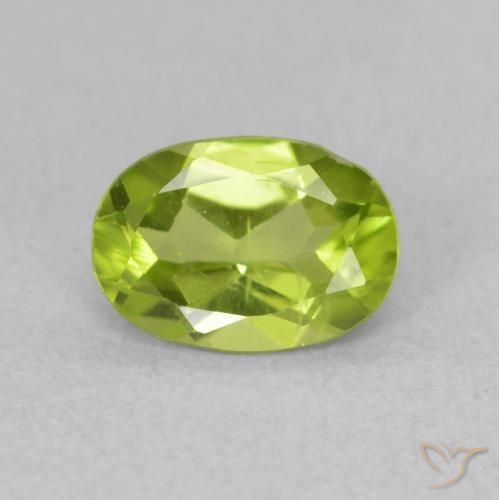 0.84ct طبيعي اخضر زاهى زبرجد, بيضوي, قليلا جدا