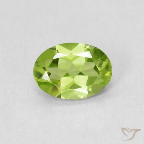 0.81ct طبيعي أخضر مصفر زبرجد, بيضوي, قليلا جدا