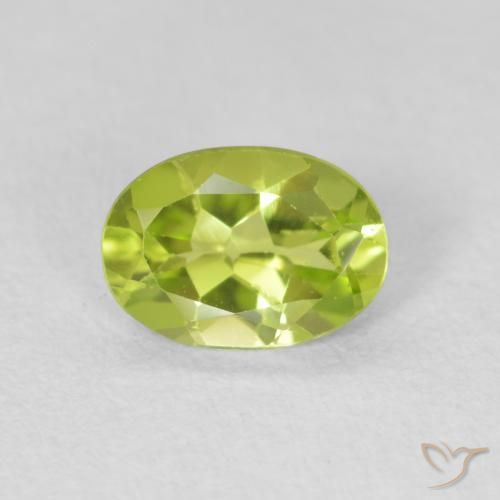 0.71ct طبيعي اخضر زاهى زبرجد, بيضوي, قليلا جدا
