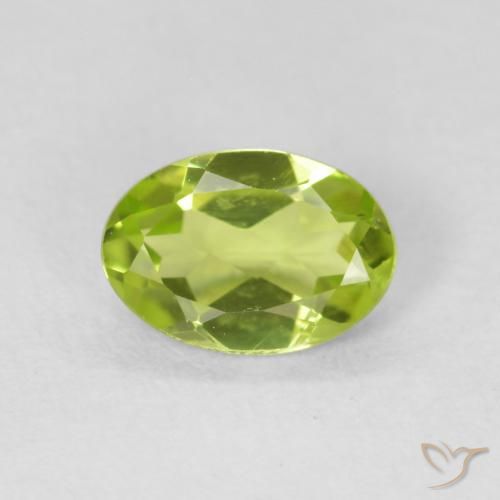 0.75ct طبيعي اخضر زاهى زبرجد, بيضوي, قليلا جدا