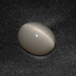 Quartz Cat's Eye طبيعي بلون دخاني، وزن ‎3.07‎ قيراط، شكل بيضاوى، مقاس ‎10x8.2‎ مم