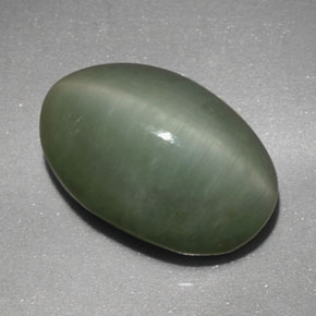 Quartz Cat's Eye طبيعي بلون أخضر، وزن ‎4.77‎ قيراط، شكل بيضاوى، مقاس ‎12.4x8.3‎ مم