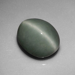 Quartz Cat's Eye طبيعي بلون أخضر، وزن ‎6.01‎ قيراط، شكل بيضاوى، مقاس ‎11.6x9.6‎ مم