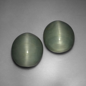 أحجار كوارتز عين القط أخضر طبيعية، قصة بيضاوى، غير شفاف، وزنها  قيراط