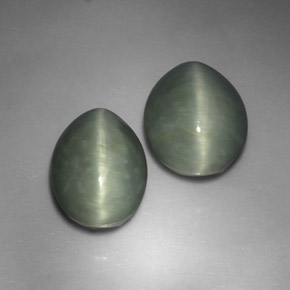 Quartz Cat's Eye طبيعي بلون أخضر، وزن ‎‎ قيراط، شكل بيضاوى، مقاس ‎13.2x9.8‎ مم