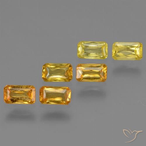 ياقوت طبيعي بلون Medium-Light Orange-Gold ، وزن ‎1.86‎ قيراط، شكل قص الزمرد، مقاس ‎4.9x2.9‎ مم