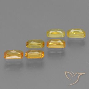 ياقوت طبيعي بلون Medium-Light Orange-Gold ، وزن ‎1.86‎ قيراط، شكل قص الزمرد، مقاس ‎4.9x2.9‎ مم